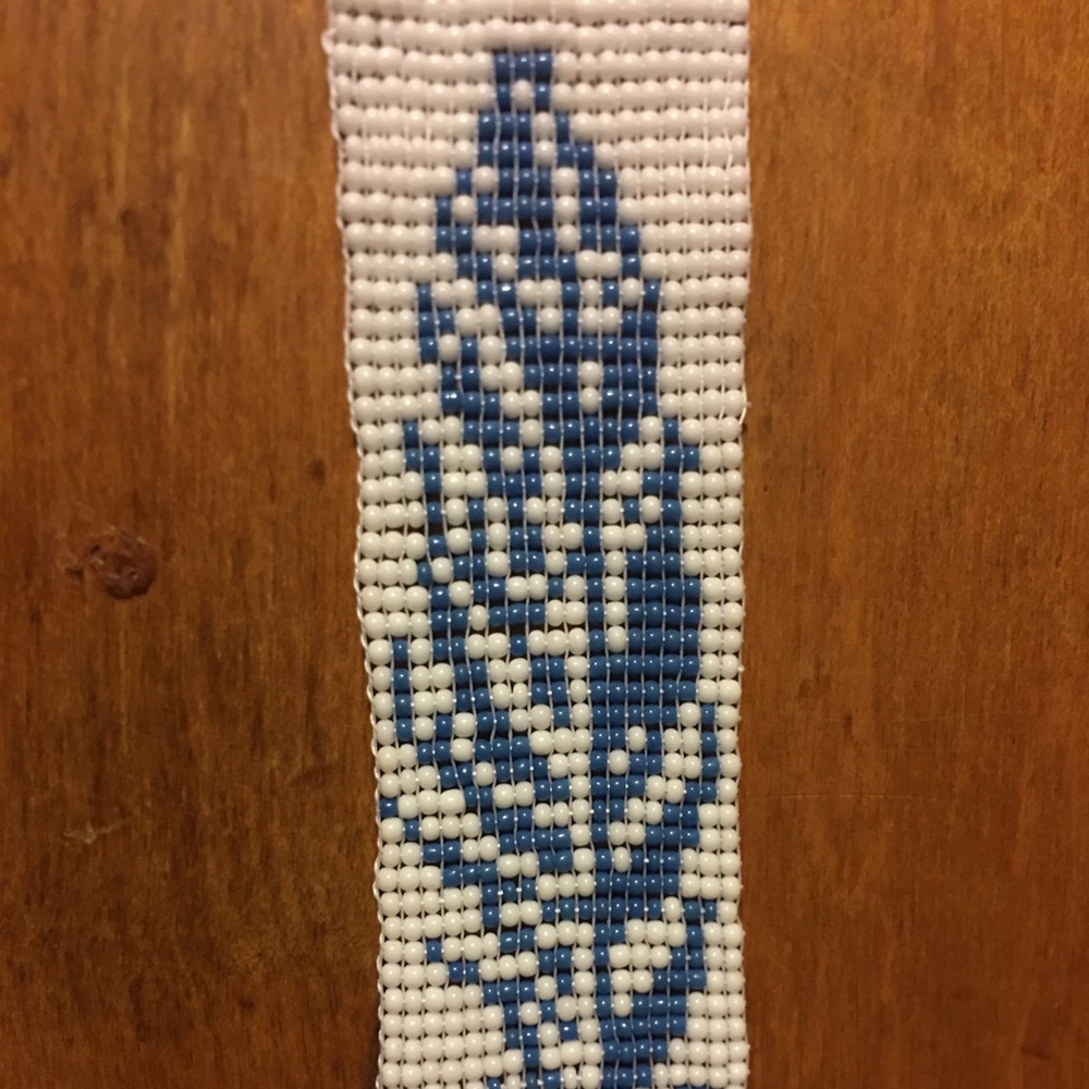 Beaded feather bracelet with extension